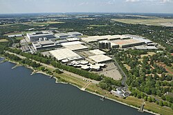 Aerial view of Messe Düsseldorf in Stockum. Visible in the background are Kaiserswerth (center) and Düsseldorf Airport (right)