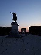 View of the water tower and the statue at sunset.