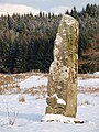 A standing stone in the snow