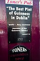 A sign on the outside wall of Toner's Pub in 2010