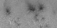 Close view of spider formations, as seen by HiRISE under HiWish program. Polygon-shaped channels are also visible.