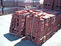 This is a picture of a stack of bricks, and first guess might be "stack" or "pile". Needs to have a single brick as the foreground subject.