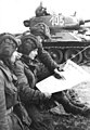 Image 28Soldiers in an East German tank unit reading about the erection of the Berlin Wall in 1961 in Neues Deutschland (from Newspaper)