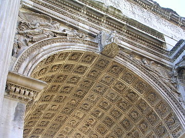 The elaborate carvings and coffered vault of the Arch of Septimius Severus in Rome