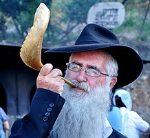 A Jewish Haredi man blowing a Shofar, 2012.
