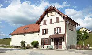 Three-story building with gabled roof