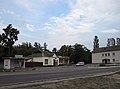 A bus stop and shops