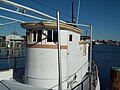 The rounded front of the deck house is a characteristic of an oyster buy-boat