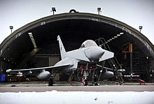 A No. 11 Squadron Eurofighter Typhoon outside a hardened aircraft shelter at Coningsby.