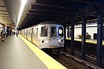 An R train of R46s at Bay Ridge Avenue in September 2018