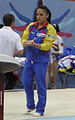 Cerasela Patrascu, during 2010 World Artistic Gymnastics Championships, wears the Romanian flag colours on her tracksuit.