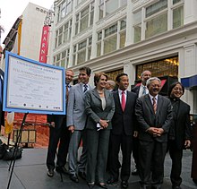 A group of politicians celebrate the completion of funding for the Central Subway Project