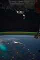 Cupola over the darkened Earth, in orbit in the vicinity of Brisbane, Australia