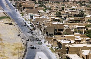 Area surrounding the Jordanian embassy after the bombings. Burnt out cars and debris are visible.