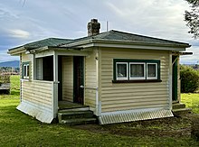 small square modernist weatherboard house
