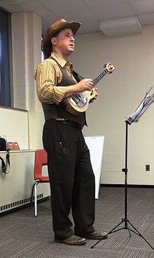 Lil' Rev, with his Mya-Moe resonator ukulele teaching a class.