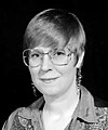 Lois McMaster Bujold with pixie cut and denim western shirt, 1996.