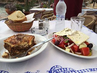 Horiatiki salad served with moussaka in Laconia, Peloponnesus