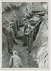 German prisoners of war burying the victims of the Klooga concentration camp in a mass grave in 1944. The camp near Klooga, Estonia in German occupied North-West Estonia was notorious for wanton killings, epidemics and working conditions. Most of the prisoners were Jews.