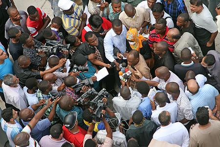 Press conference near the ground zero of the 2013 Dar es Salaam building collapse, by Muhammad Mahdi Karim