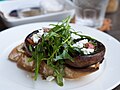 Grilled portobello, feta, and arugula salad on a toasted baguette