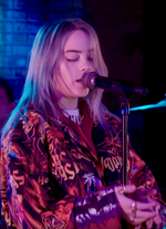 Billie Eilish performing in an MTV event