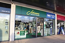 a joint Johnsons and Max Spielmann shop front on the high street