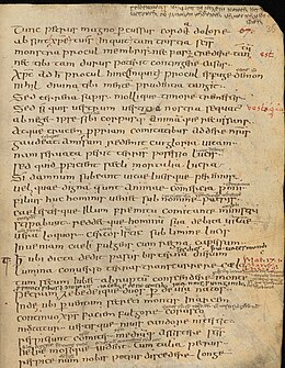 A handwritten medieval manuscript, written in Latin: lines are double-spaced, often with notes between or alongside them