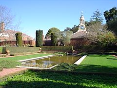 Reflecting pool and former carriage house.