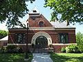 Flint Public Library (1891–92), Middleton, Massachusetts. MacDonald designed the stained glass windows at left & right.
