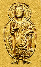127-150 CE The Buddha in Gandhara style on a coin of Kanishka I
