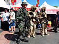 ROCMC Special Forces Team standing behind 66th Brigade Recruitment Booth
