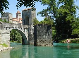 View up to Medieval village of Sauveterre de Bearn with the Pont de la Legende (foreground)