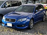 Subaru Legacy tuned by STI, a high-performance variant of the standard Subaru Legacy station wagon. This photo shows the front of the car, which is blue.