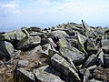 Lichen-covered stone slabs on the top