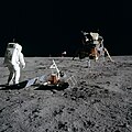 Aldrin stands next to the Passive Seismic Experiment Package with the Lunar Module in the background.