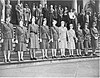 Women in uniform standing on steps