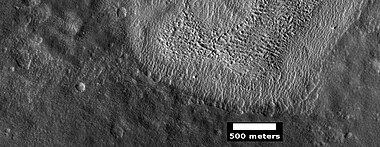 Contact between lower light-toned unit and an upper dark unit, as seen by HiRISE under HiWish program