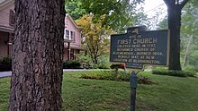 a picture of the marker with the house and a tree on the site