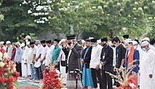 Muslims, wearing face masks gather for the Eid al Adha prayer in Indonesia.