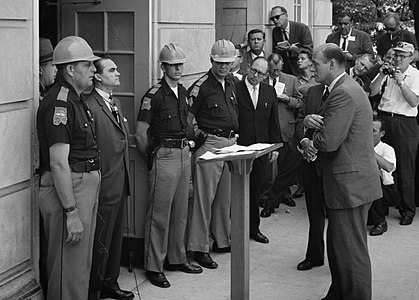 George Wallace stands at the door of the Foster Auditorium at Stand in the Schoolhouse Door, by Warren K. Leffler (edited by Calliopejen1)