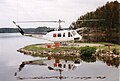 A Bell 205A-1 on contract firefighting duty with Ministry of Natural Resources parked on the MNR's lower helipad at Nym Lake, ON, 1996