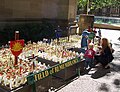 A young family look at the crosses planted in the ANZAC Field of Remembrance in Sydney, Australia