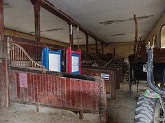 Former stables, equipped with stalls.