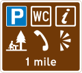Distance ahead to a parking place with a Tourist Information Point, picnic site, public telephone, public toilets and viewpoint