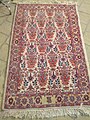 A carpet with Zell ol Soltan motif