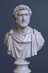 Bust of a bearded man with curly hair wearing a toga.