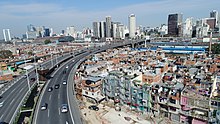 Slum housing next to motorway