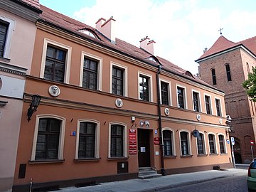 Facade viewed from Jezuicka Street, with famous figure medallions