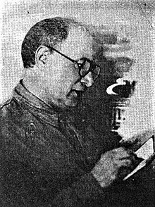 Yakov Yadov, the song's writer, reading a book